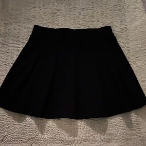 black pleated skirt